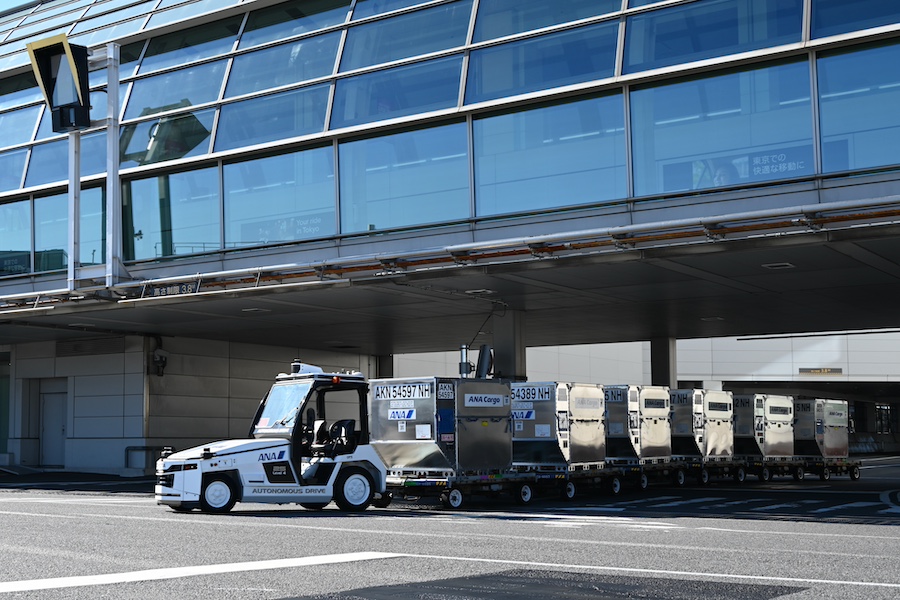 Autonomous towing tractor following a set route on the apron
