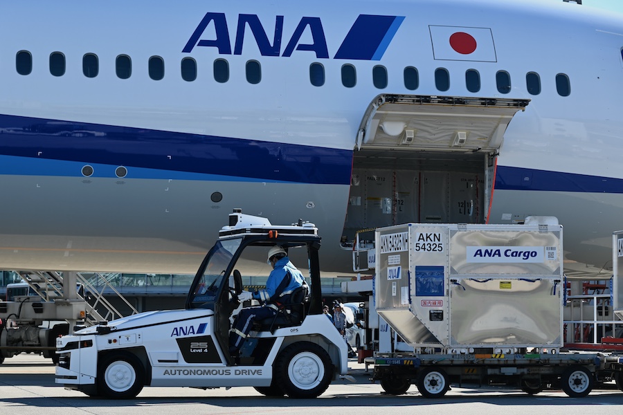 Cargo containers being towed automatically at Haneda