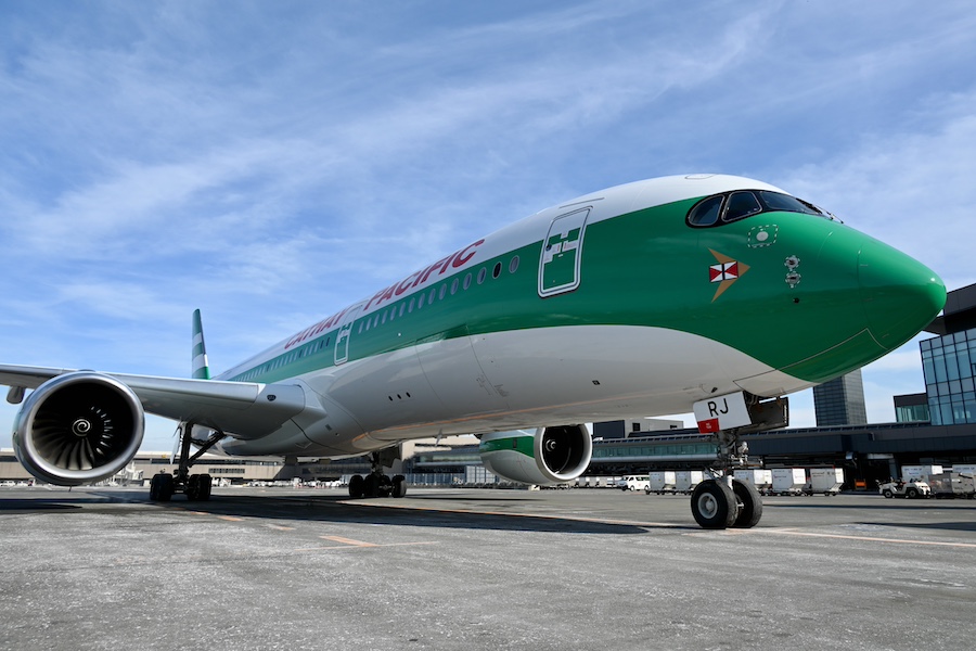 Cathay Pacific and Narita Airport staff posing in retro uniforms