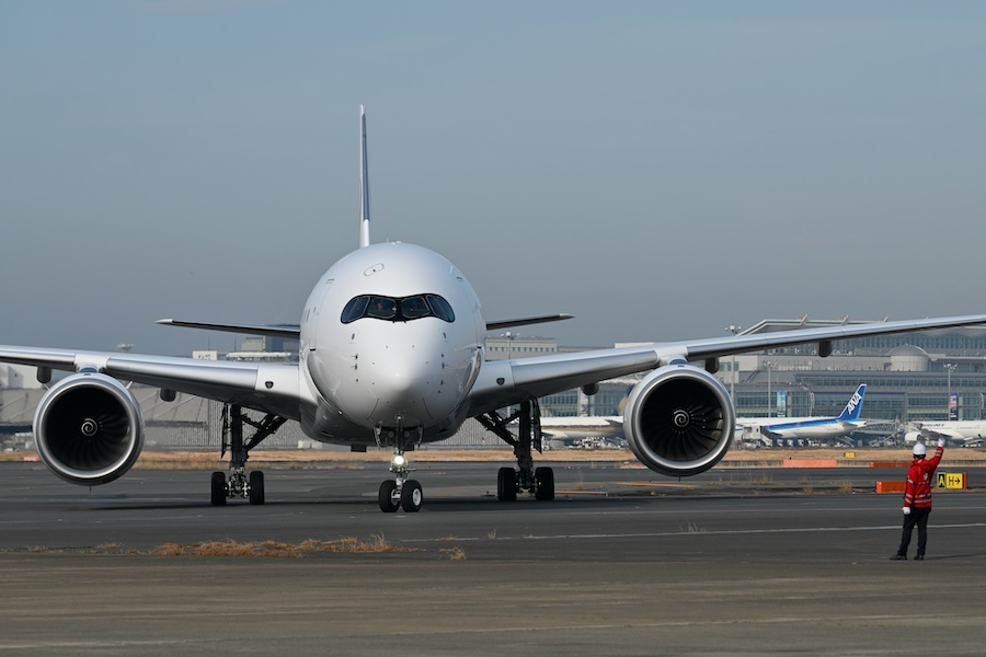 JAL Airbus A350-1000 at the parking spot in front of the hangar
