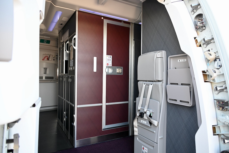 JAL Airbus A350-1000 taxiing with terminal building in the background