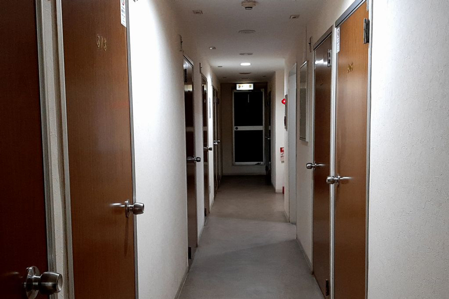 Corridor and elevator area inside Hotel Lucky