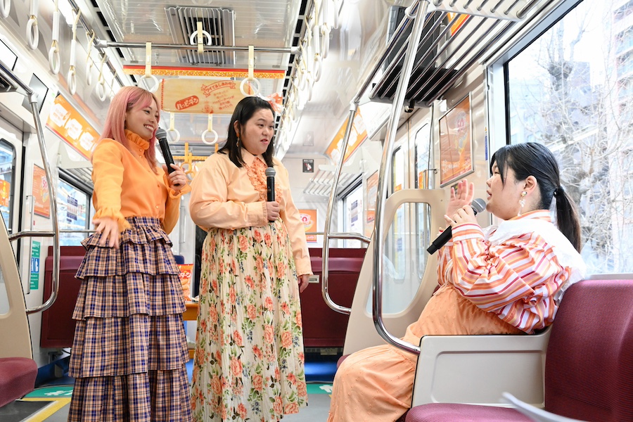 Borujuku members (from left) Haruka Kiriya, Tomoka Tanabe, and Anri touring the interior of the Happy Turn Train