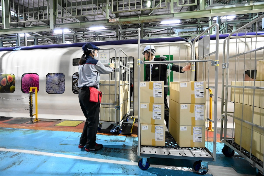 Roll containers being handled at the Shinkansen rolling stock center