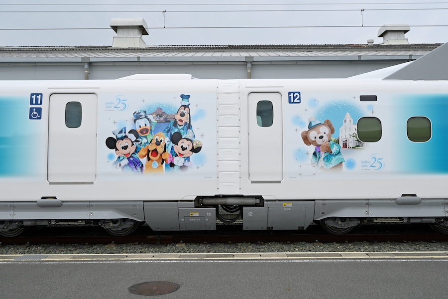 Character illustrations along the cars