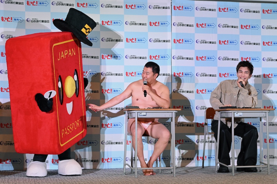 Takanori Iwata and Yasumura learning about the new Japanese passport system