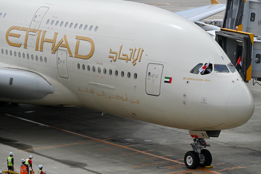 Etihad Airways A380 pilots displaying flags of Japan and UAE